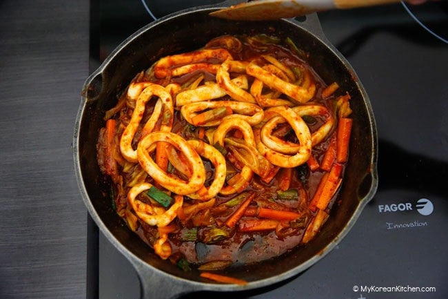 stir frying spicy squid with vegetables