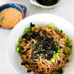Cold soba noodles with a caption that reads "cold soba noodles with perilla oil dressing"