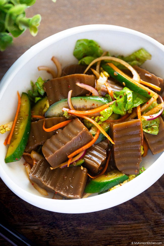 Close-up photo of dotorimuk muchim served in a shallow white bowl.