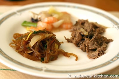 Korean buffet - Japchae, Bulgogi, Shrimp and mushrooms in starch sauce 