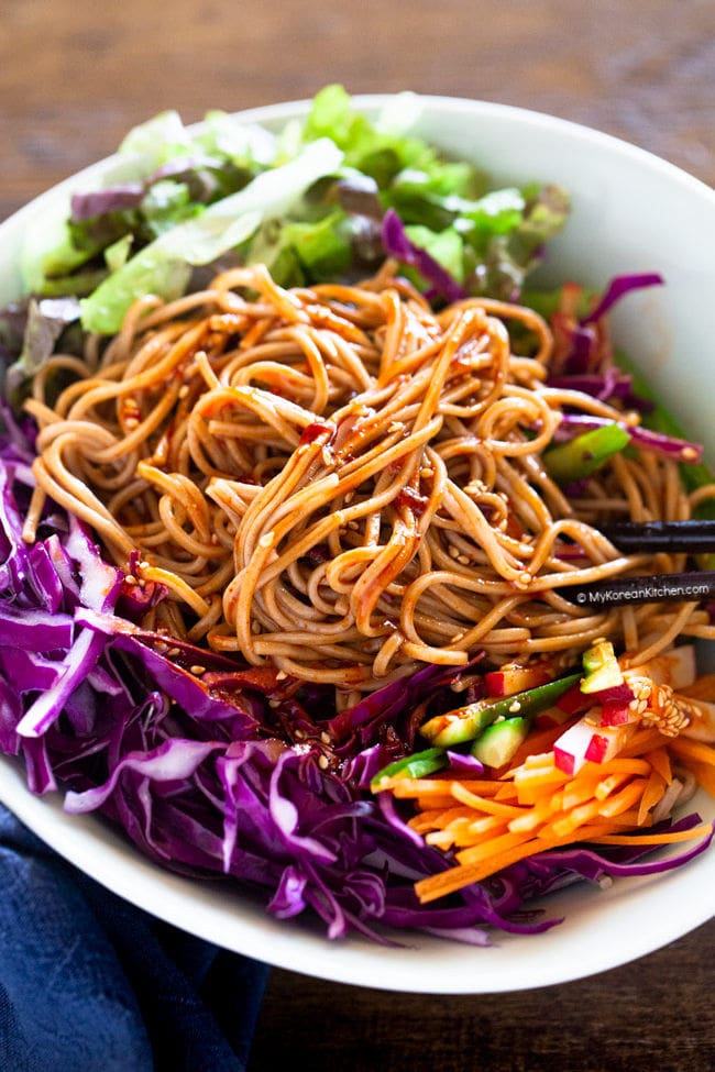 Bibim guksu served with assorted vegetables