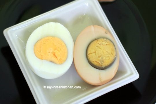 Boiled egg in a pot vs. pressure steamed egg cut in half