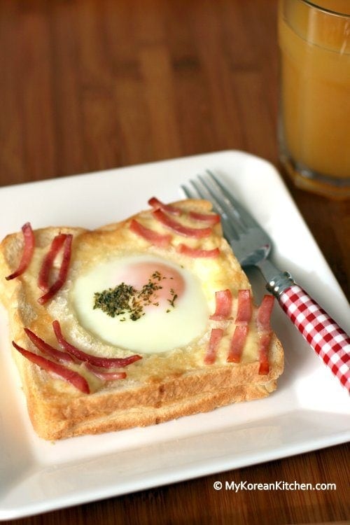 egg in a basket decorate with sliced ham