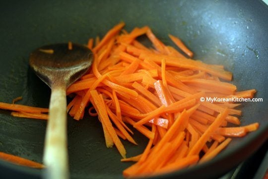 Stir frying carrots for Bibimbap