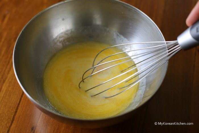 Mix 1 egg (for batter), milk, butter, vanilla essence in a small bowl and whisk them well