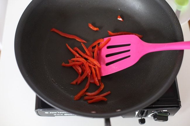 Pan frying red bell peppers