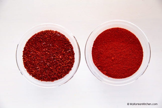 Korean chili flakes and Korean chili powder in two separate bowls