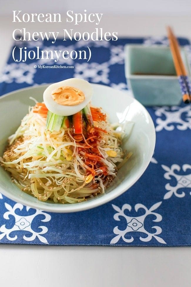 Spicy cold noodles topped with an egg, beansprouts, and cucumbers. 