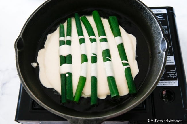 green onions laid on top of pancake mix