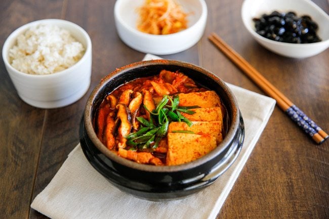 The classic Kimchi Jjigae (Kimchi stew) recipe with some fatty pork. When the fat from the pork melts into the soup, it becomes irresistibly delicious! | MyKoreanKitchen.com