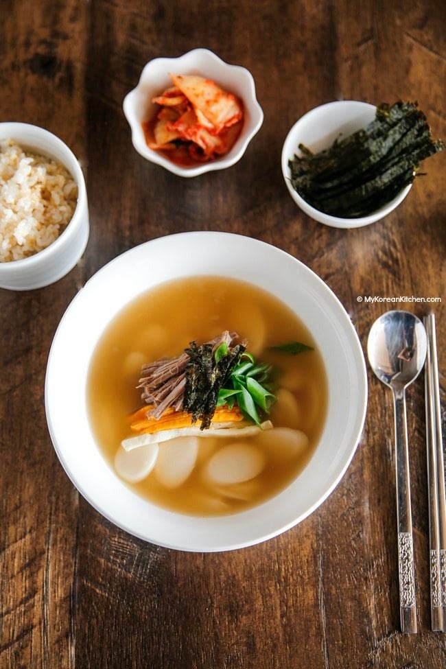 Tteokguk is one of our New Year's recipes from South Korea. A Bowl of Tteokguk with chopsticks