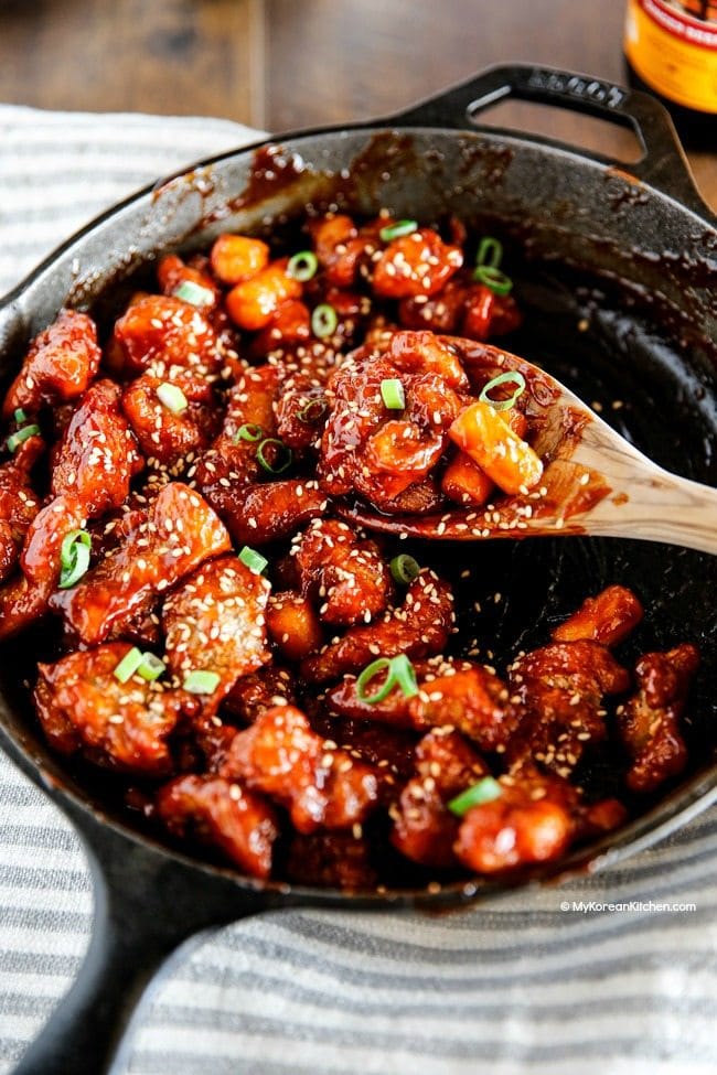 Korean style popcorn chicken. It's a crunchy and sticky bite-sized chicken coated with delicious Korean sauce! | MyKoreanKitchen.com