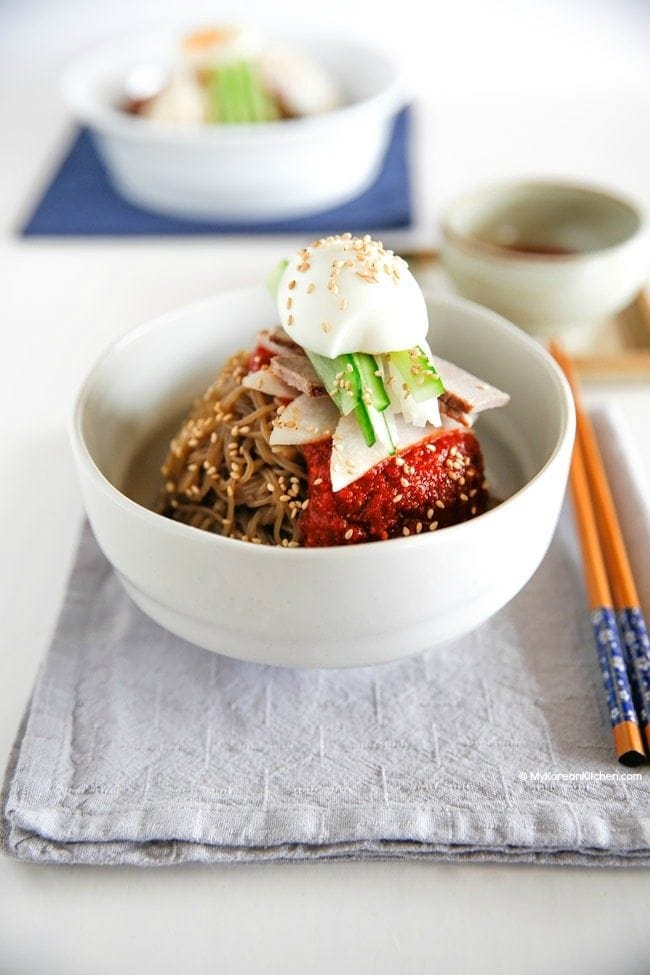 Bibim Naengmyeon is a perfect way to beat the summer heat! It's cold, spicy, sweet and tangy. Everything you need is all in one bowl! | Food24h.com