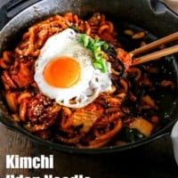 Kimchi udon noodle stir fry is an easy weeknight meal that can be ready in 15 mins. Key ingredients are bacon, Kimchi, udon noodles and Korean spicy sauce. It's simply addictive! It will be your new favourite noodle dish! | Food24h.com