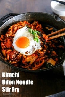 Kimchi udon noodle stir fry is an easy weeknight meal that can be ready in 15 mins. Key ingredients are bacon, Kimchi, udon noodles and Korean spicy sauce. It's simply addictive! It will be your new favourite noodle dish! | MyKoreanKitchen.com