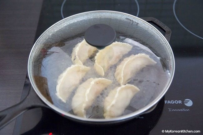 Pan frying Kimchi Mandu (Kimchi Dumplings)