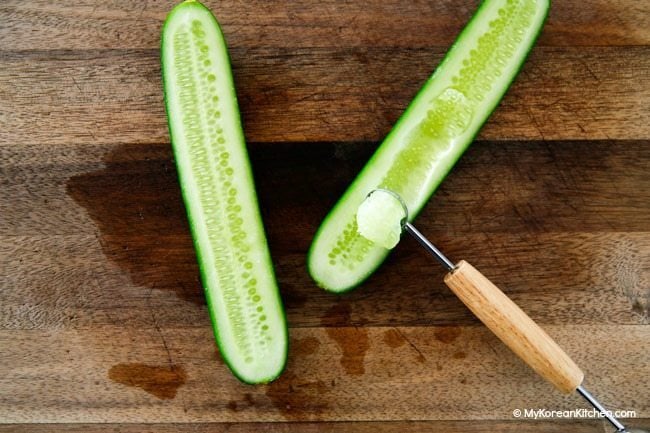 Carve out cucumber seeds for cucumber boats