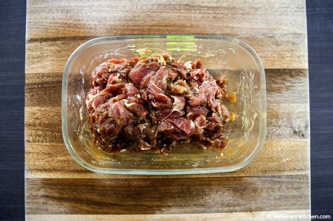 Marinated bulgogi in a glass container