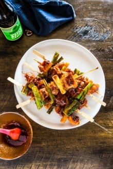 Chicken skewers stacked on a place