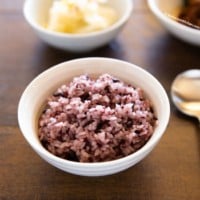 Purple rice served in white bowl