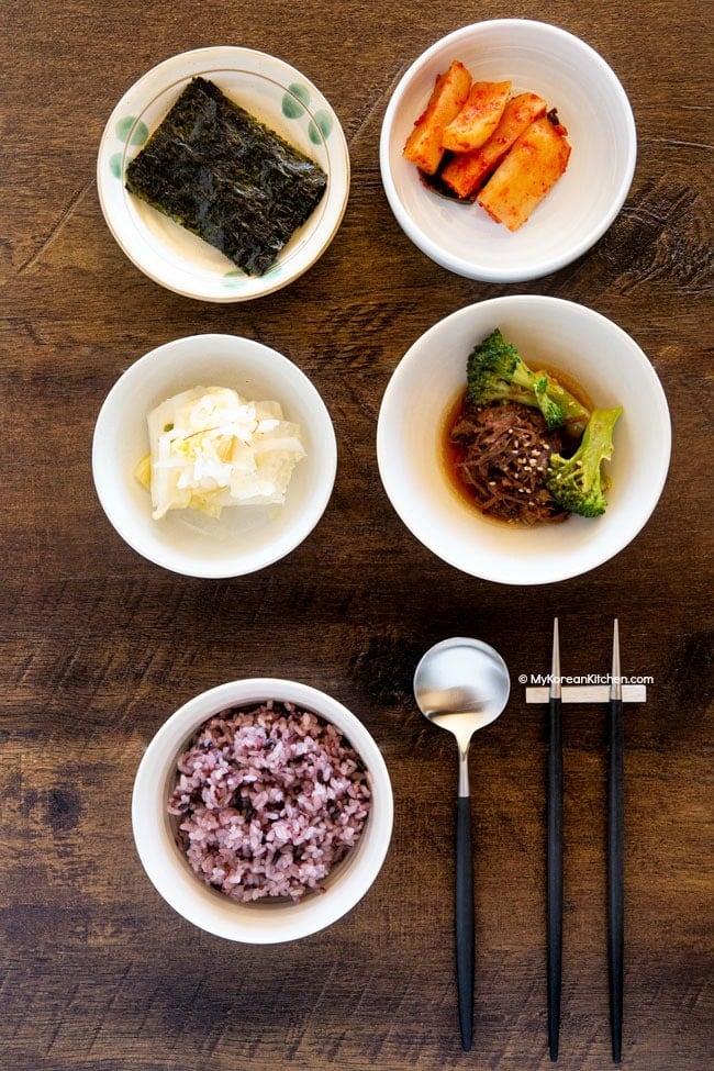 Korean purple rice served with various Korean side dishes