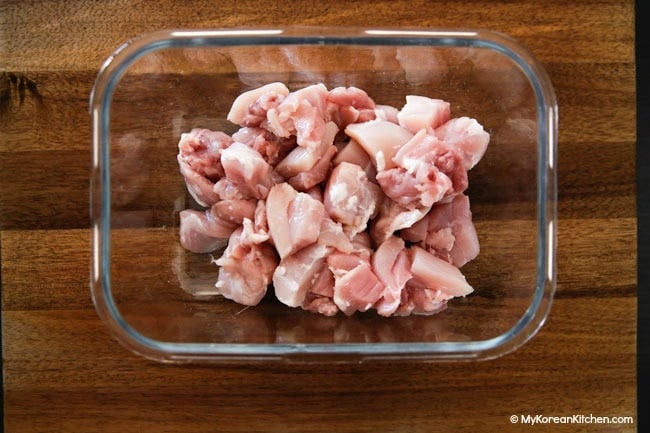 Chopped chicken in a glass container