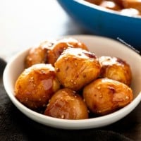 Braised potatoes in a shallow bowl