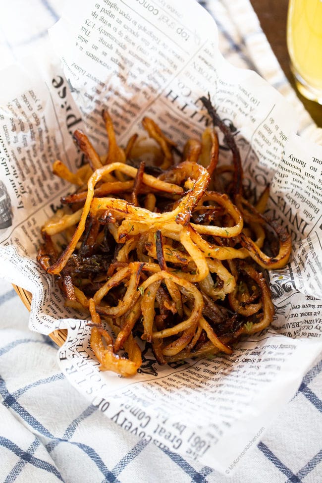 honey butter squid jerky served on parchment paper