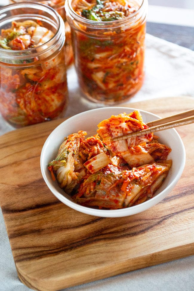 Holding kimchi with chopsticks