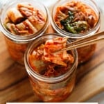 Three jars filled with kimchi