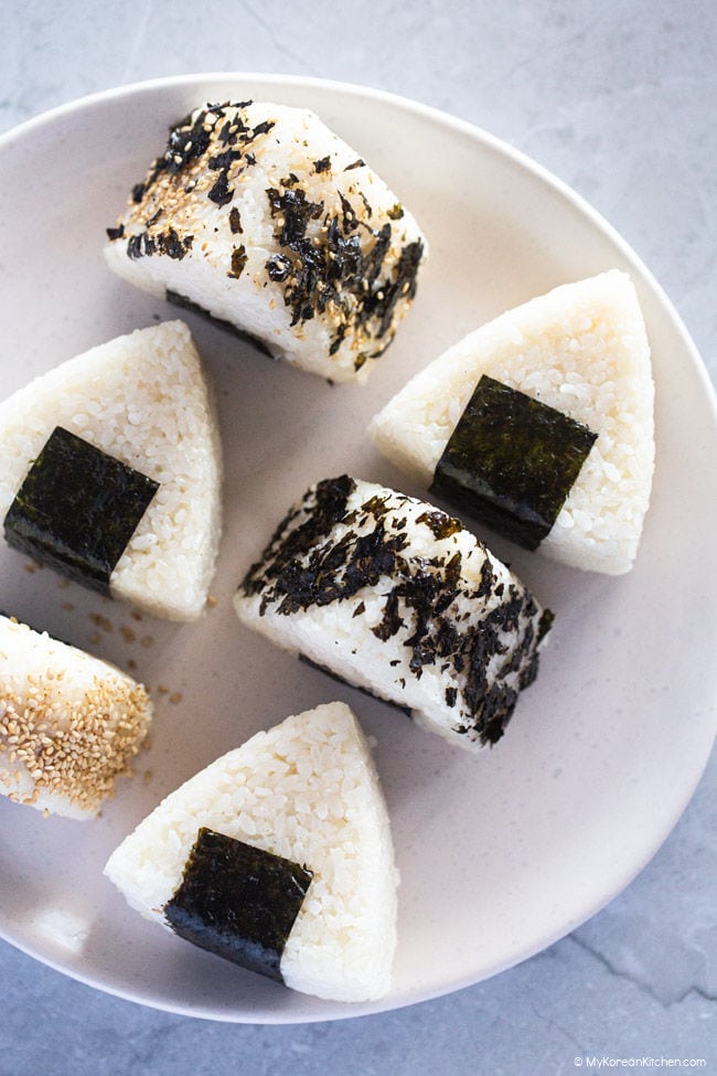 Rice triangles covered with seaweed and rice seasoning.
