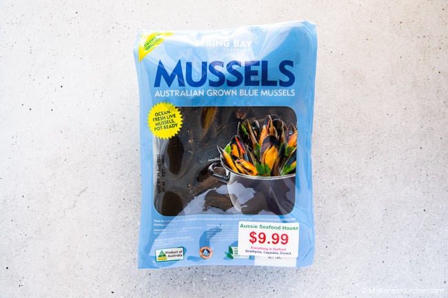 Fresh blue mussels packaged in a bag.
