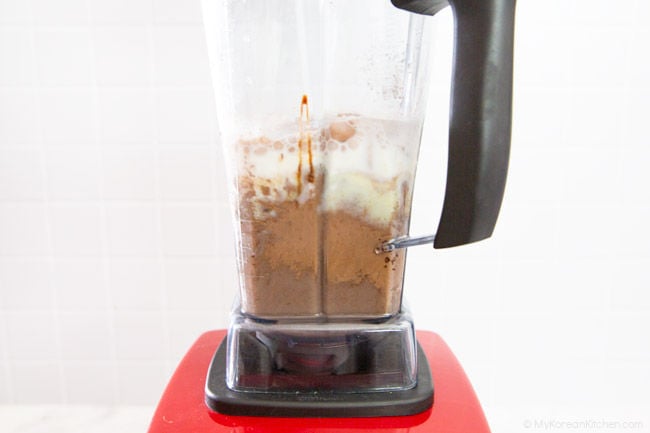 Blending chocolate honey jolly pong milkshake in a Vitamix