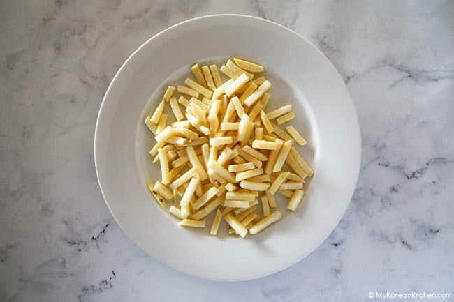 French fries on a white plate.