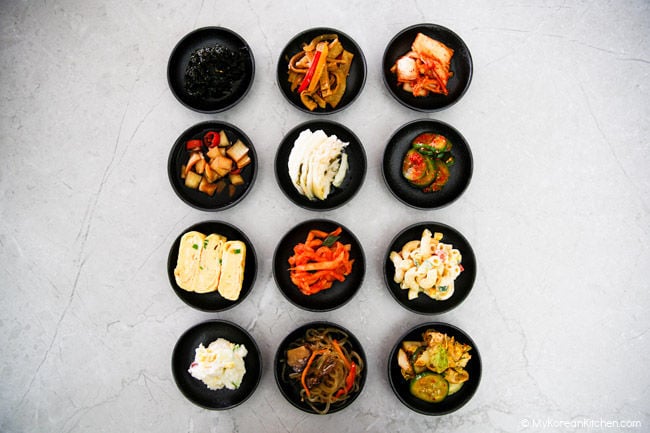 12 Korean side dishes are served in small tapas bowls.