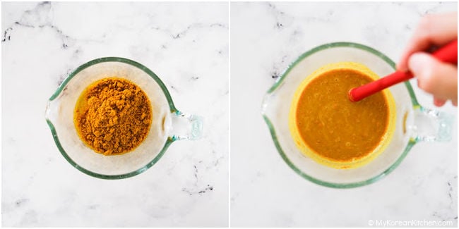 Curry powder mixed in a measuring cup.