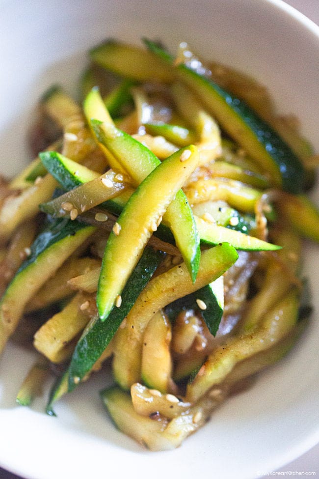 Close-up photo of stir-fried Korean zucchini on a small plate.