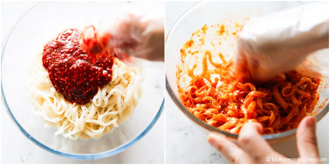 Kalguksu noodles mixed with spicy bibim sauce in a clear bowl, with gloved hands.