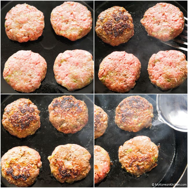 Beef patties sizzling in a skillet during pan frying.