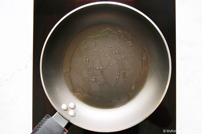 Heated frying pan on stove.