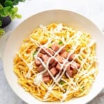 Spam egg mayo rice bowl served in a shallow bowl, with the rice hidden underneath as the base.