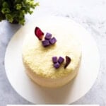 Top-down shot of a Korean sweet potato cake on a white cake stand.