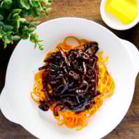 Black bean sauce served over carrot noodles