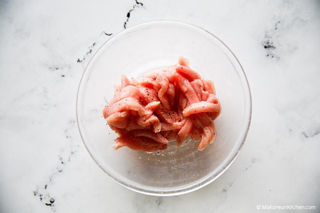 Marinating pork for jajang sauce in a bowl