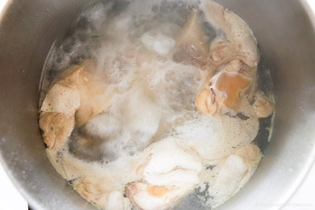 Parboiling beef bones to remove impurities before cooking