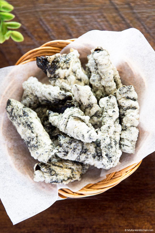 Close up of Korean seaweed chips in a small round basket