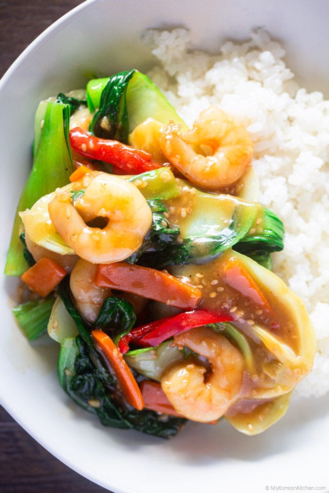 stir-fried bok choy and shrimp served over steamed rice