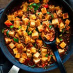 Korean mapo tofu served in a skillet with tender tofu cubes and rich spicy sauce