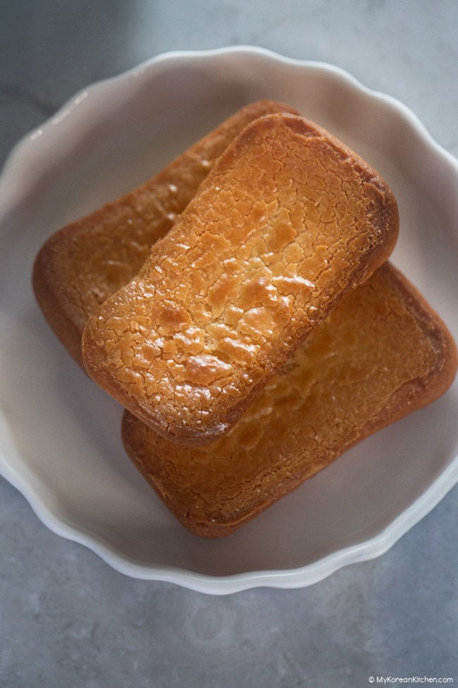 close-up photo of stacked butter tteok on a plate