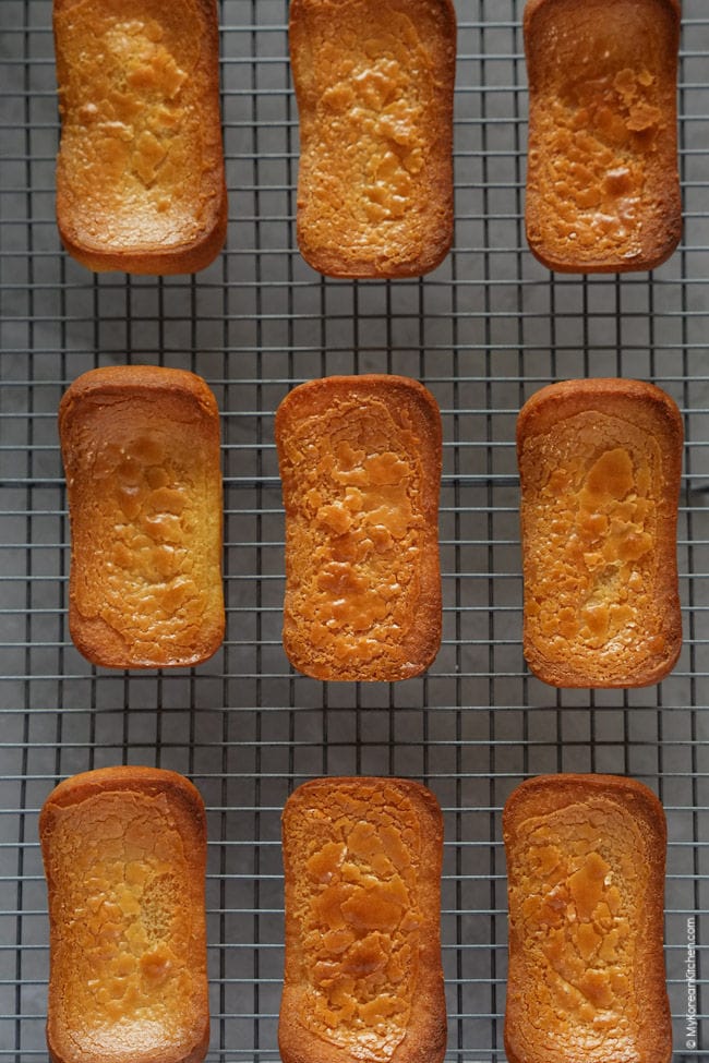 freshly baked butter tteok cooling on a wire rack